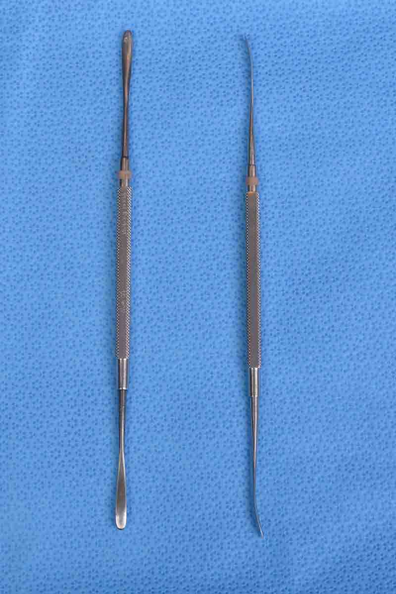 This is a multipurpose tool used in many procedures, commonly to elevate the periosteum from bone in confined spaces. It is double ended and typically has a rounded handle with two slightly curved, tear-drop shaped tips. One tip is blunt while the other is sharp. The curvature of the tips allows for the navigation of contours, such as when elevating the periosteum during repair of orbital floor fractures.